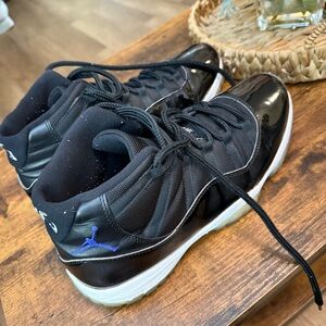 Nike Air Jordan 11 Retro Black and White High-Top Sneakers with Blue Accent Mens